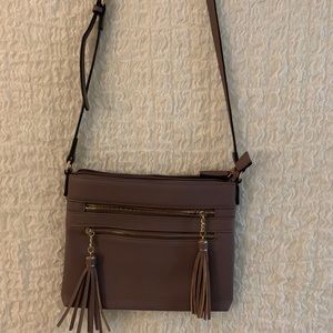 purple crossbody purse with tassels